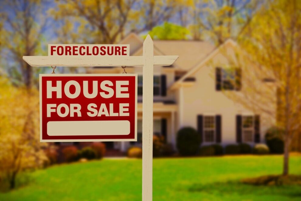 Foreclosure Home For Sale Sign in Front of House